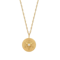 A gold chain necklace with a round, sunburst-textured gold pendant featuring a small clear central gemstone, shown against a plain white background.